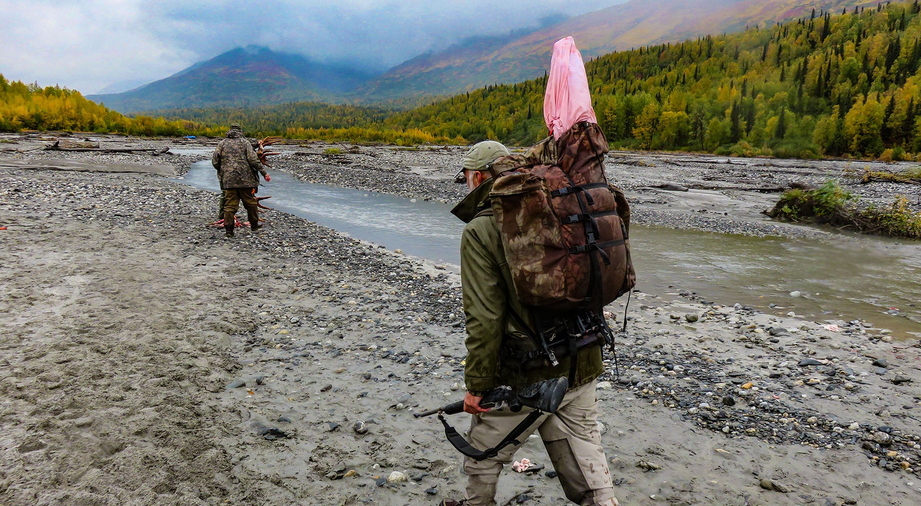 Packing out a heavy moose quarter on a Barney's pack.